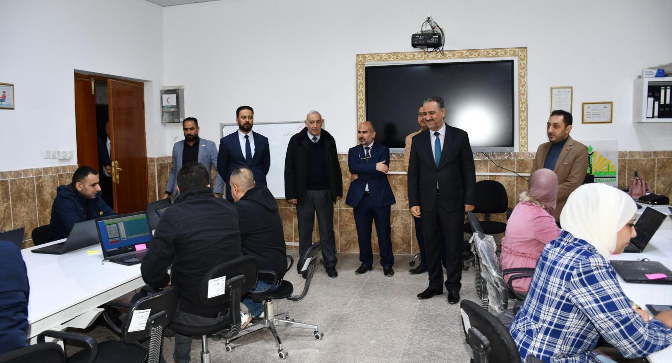 The President of the University of Fallujah conducts an inspection visit to the electronic calculator center at the university
