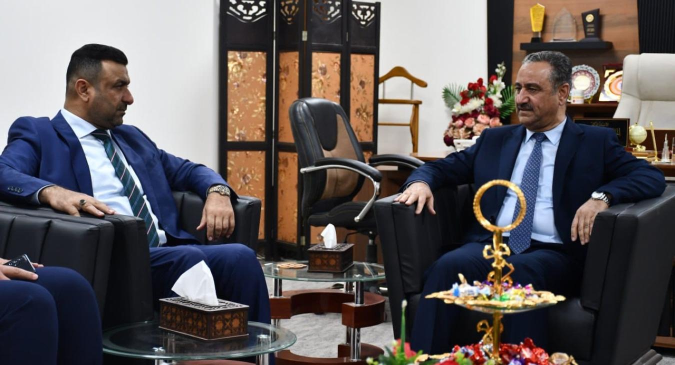 The President of Fallujah University receives the representative of Anbar Governorate, Yahya Al-Muhammadi