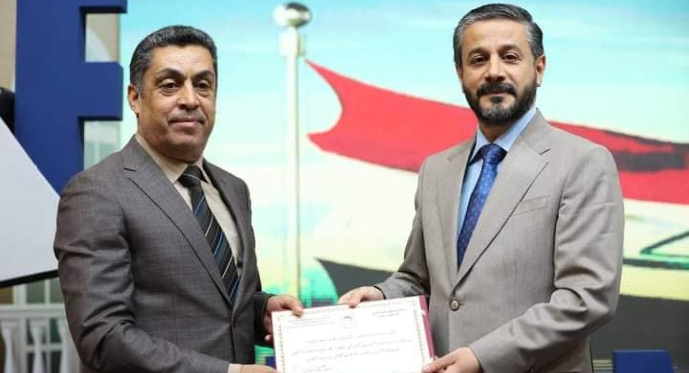 His Excellency the Minister of Higher Education honors the Director of the Department of Construction and Projects at the University of Fallujah on the occasion of Iraqi Engineer Day