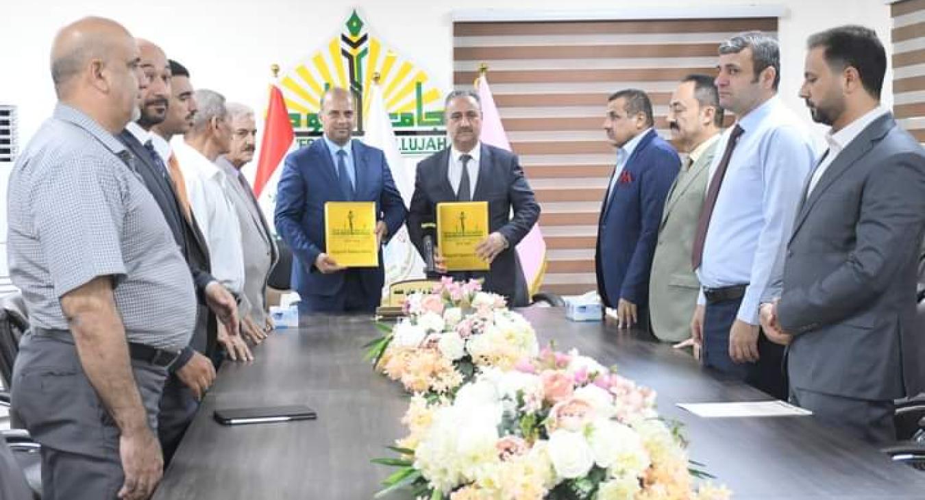 The President of the University of Fallujah receives the Dean of Al-Idrisi University College and they sign a joint cooperation agreement